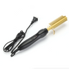 Image of Hair straightening tool with black handle and gold bristle brush on a white background