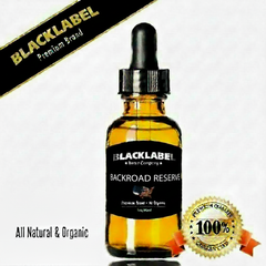 A 10ml glass dropper bottle of Blacklabel Sandalwood Amber essential oil, featuring a black label and dropper cap. The image includes promotional text 'All Natural & Organic' and a '100% Premium Quality' badge on a white background.