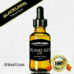 A 10ml glass dropper bottle of Blacklabel Sandalwood Amber essential oil, featuring a black label and dropper cap. The image includes promotional text 'All Natural & Organic' and a '100% Premium Quality' badge on a white background.