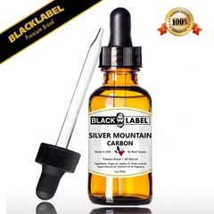 A 1 oz amber glass dropper bottle of Black Label Silver Mountain Carbon essential oil, shown with a separate black dropper cap and glass pipette on a white background. 